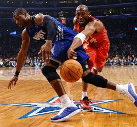Kobe Bryant attempts to steal the ball from Dwyane Wade in the first quarter. (Kevork Djansezian/Getty Images)